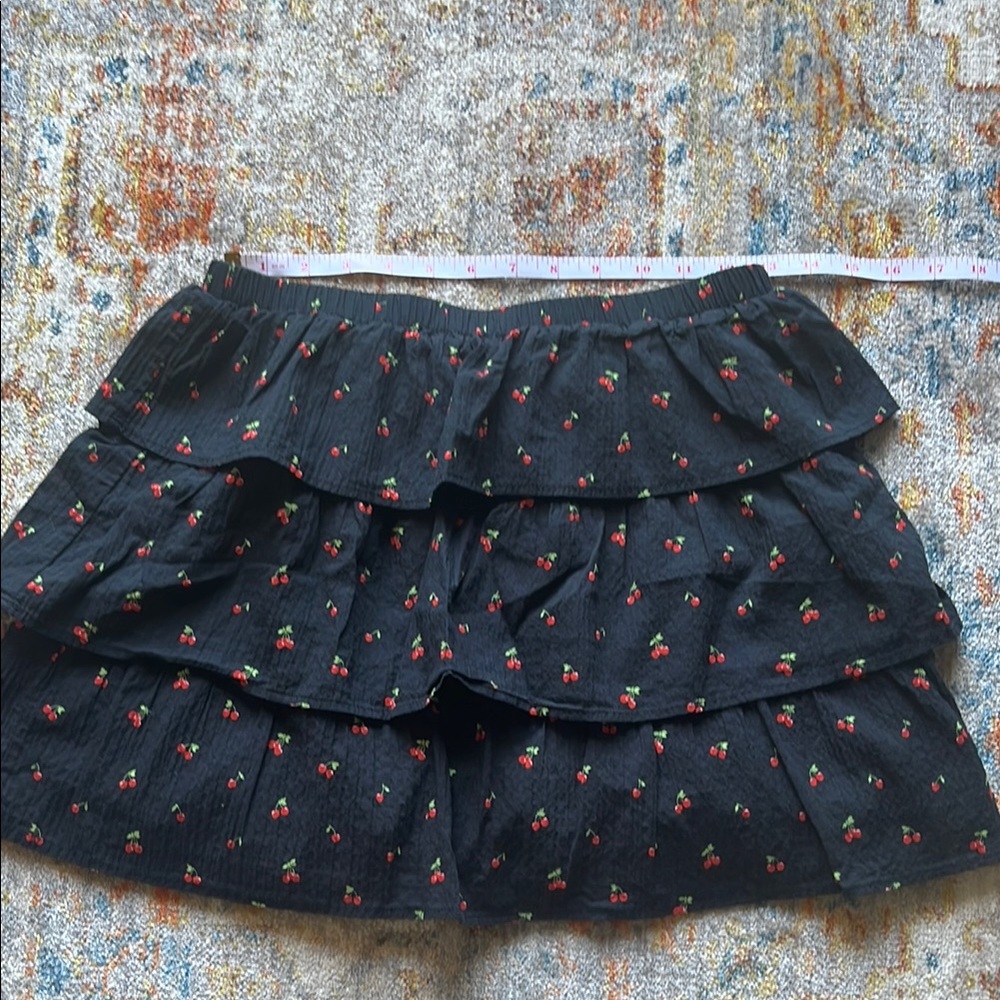 Black ruffle tiered skirt with cherry print